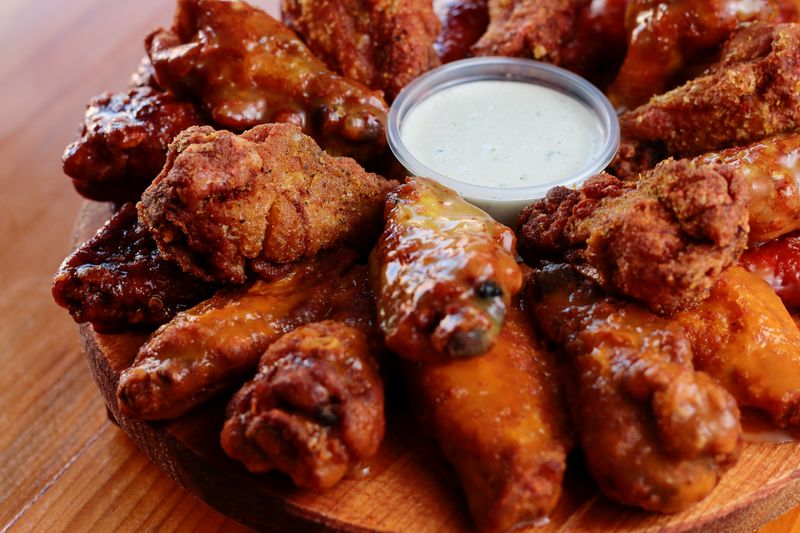 BBQ Smoked Wings slow-smoked wings over bbq sauce
